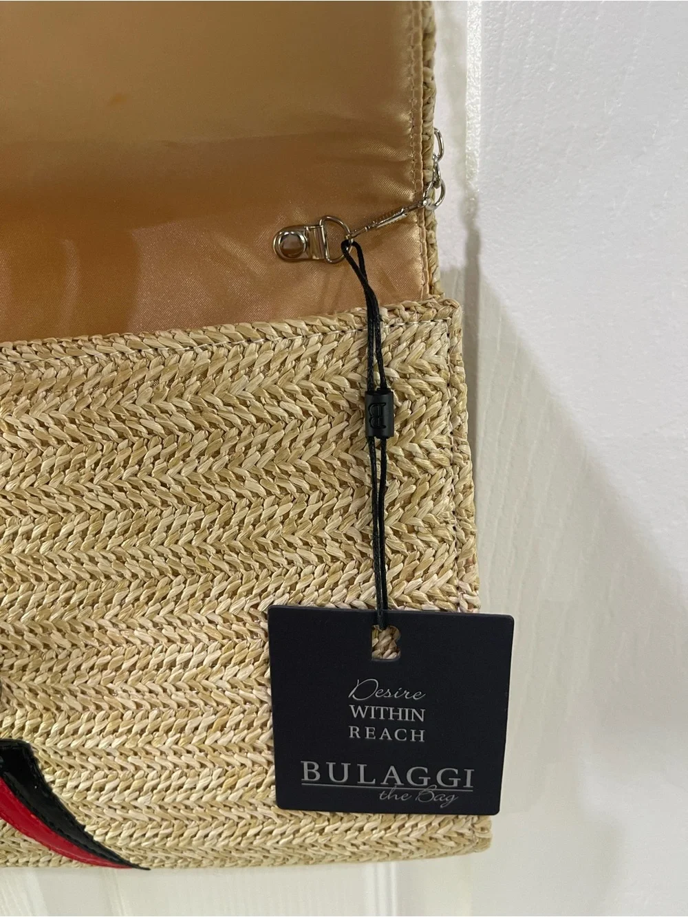 Bulaggi Natural Straw Crossbody Bag with Colorful Toucan Patch